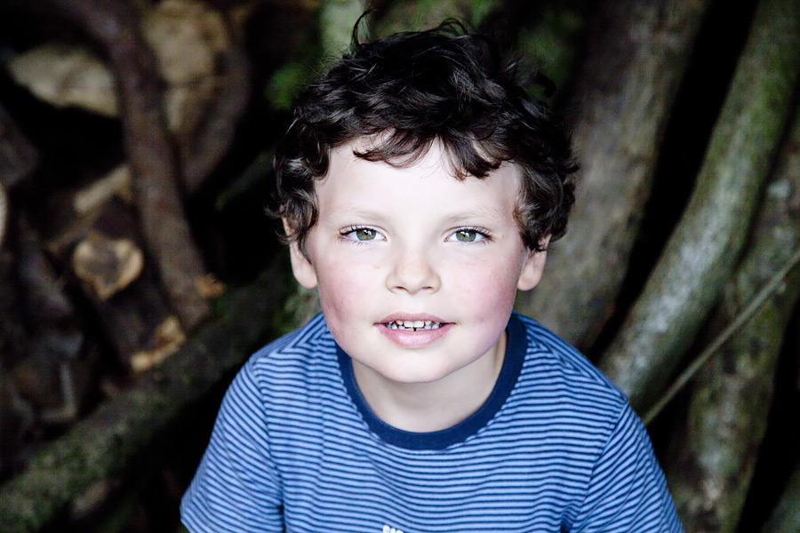 Yound lad in a blue tshirt looking at the camera