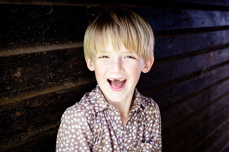 Smiling boy in a floral shirt